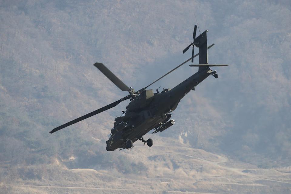 An American military helicopter hovers in the sky during a combined drill with South Korean soldiers from the 15th Infantry Division at the Rodriguez Live Fire Complex (Getty)