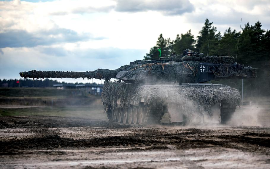 German soldiers drive a Leopard 2A6 tank during an exercise.