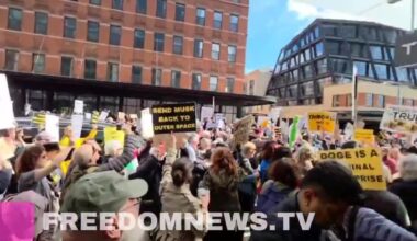 Crowd chants "Zelensky is a hero" outside of a Tesla dealership in Manhattan