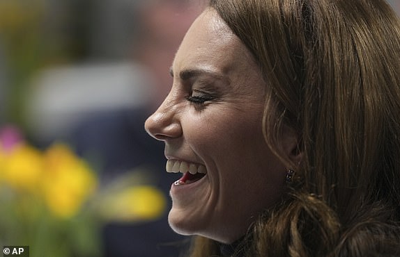 Britain's Kate, the Princess of Wales, Patron of the Rugby Football Union (RFU), laughs as she meets injured players who are supported by the Welsh Rugby Charitable Trust before she attends the Wales versus England Six Nations match at the Principality Stadium in Cardiff, Saturday, March 15, 2025.(AP Photo/Alastair Grant, Pool)