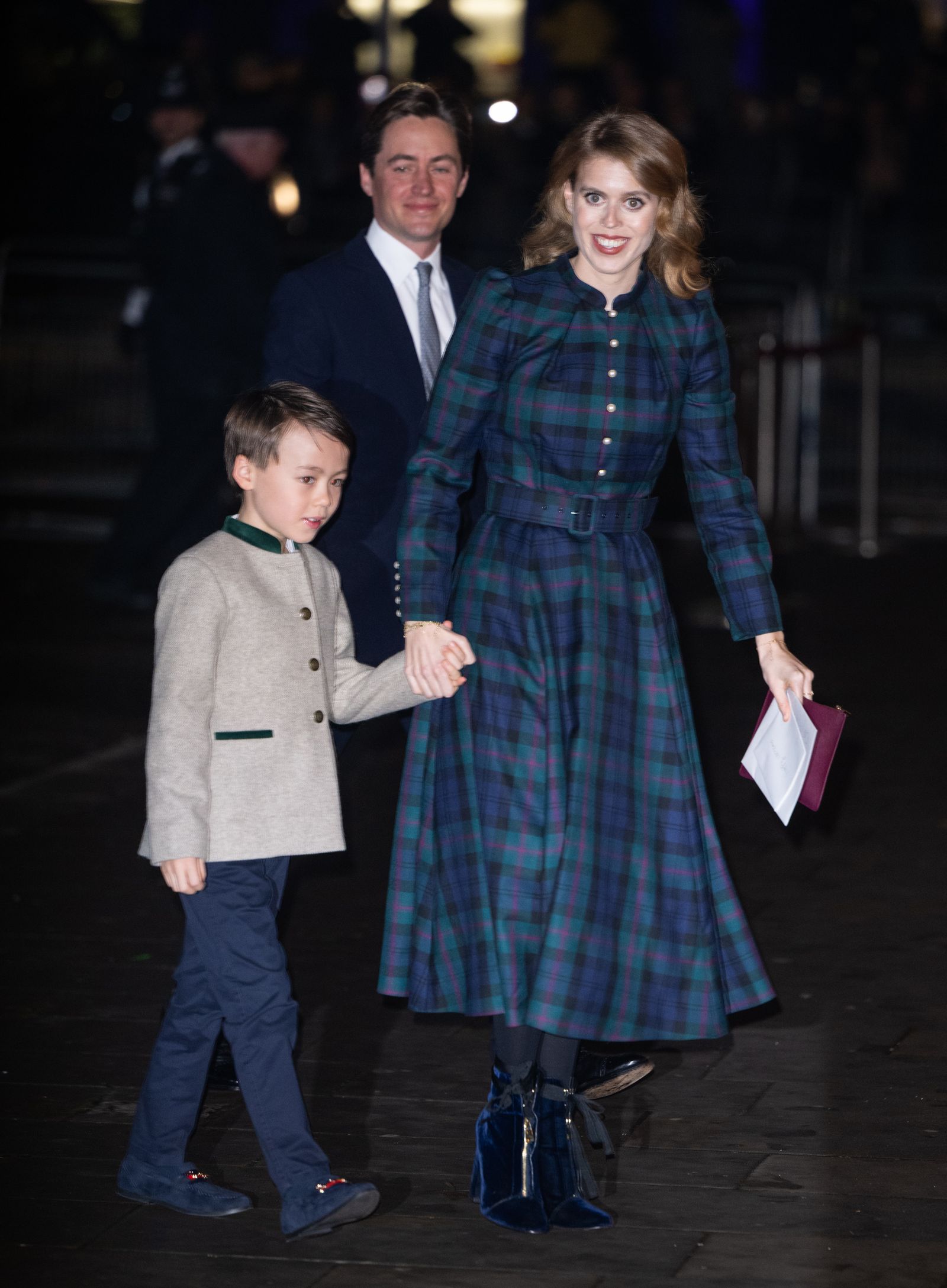 Image may contain Clothing Coat Person Footwear Shoe Child Accessories Formal Wear Tie Skirt Tartan and Adult