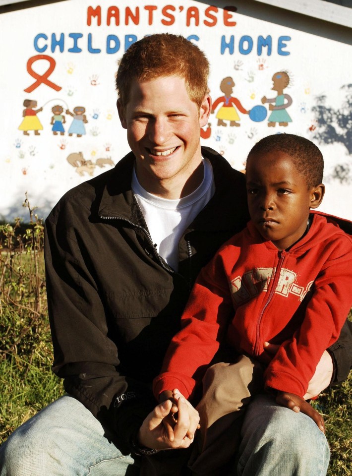 Prince Harry with a young boy at the Mants'ase Children's Home in Lesotho.