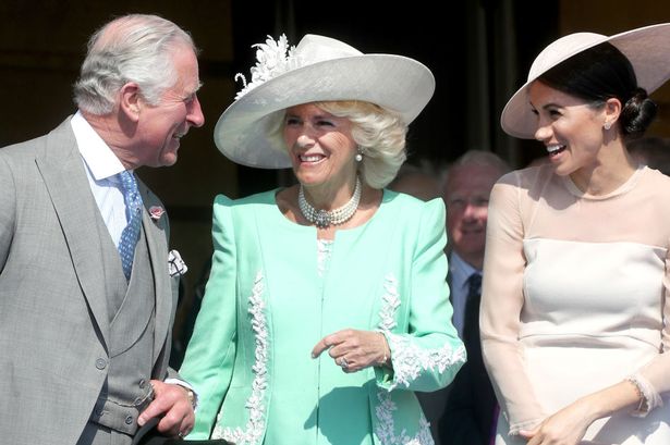 Meghan with King Charles and Queen Camilla 