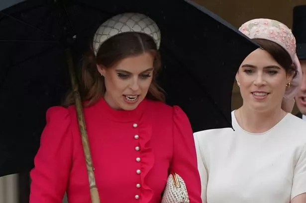 Princess Beatrice (left) and Princess Eugenie arrive for the Sovereign's Garden Party at Buckingham Palace on Tuesday