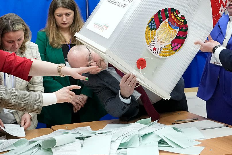 Election commission workers prepare to count ballots for the presidential election at a polling station in Minsk, 26 January, 2025