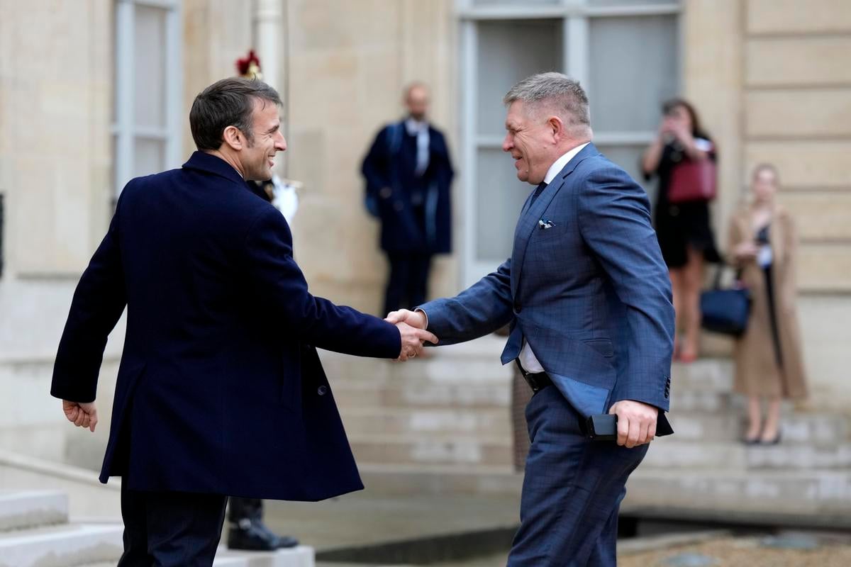 French President Emmanuel Macron, left, welcomes Slovak Prime Minister Robert Fico at the Elysee Palace in Paris, Monday, February 26, 2024.