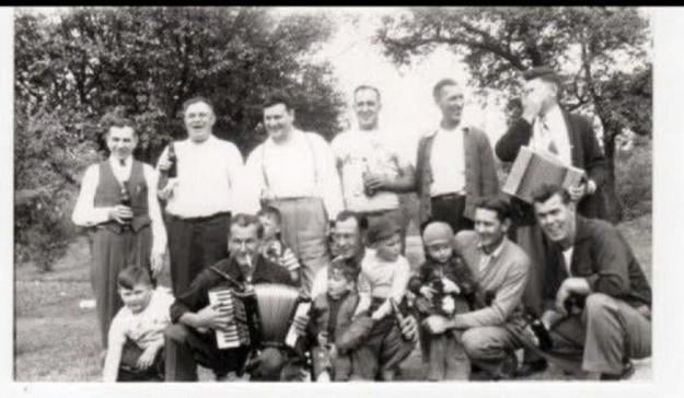 Martin (second from the left, holding a bottle)