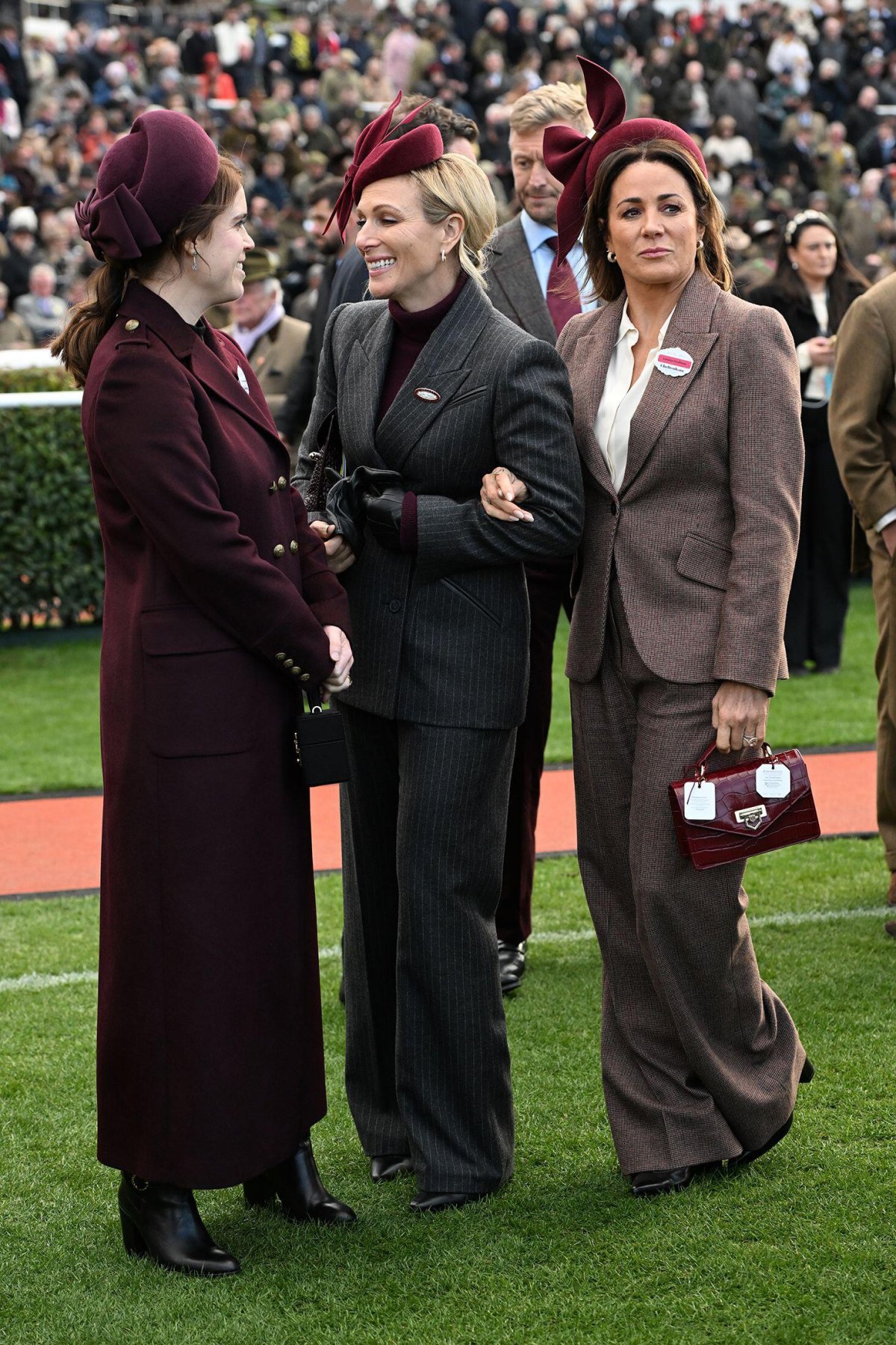 Princess Eugenie, Zara Tindall, and Natalie Pinkham attend day two of the Cheltenham Festival on March 12, 2025 (Eddie Mulholland/PA Images/Alamy)
