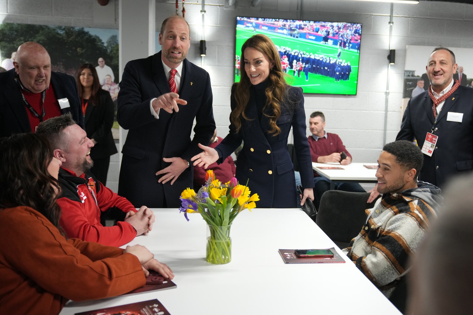 Image may contain Trevor Noah Louis de Bernières Prince William Duke of Cambridge Omar Barghouti Desk and Furniture