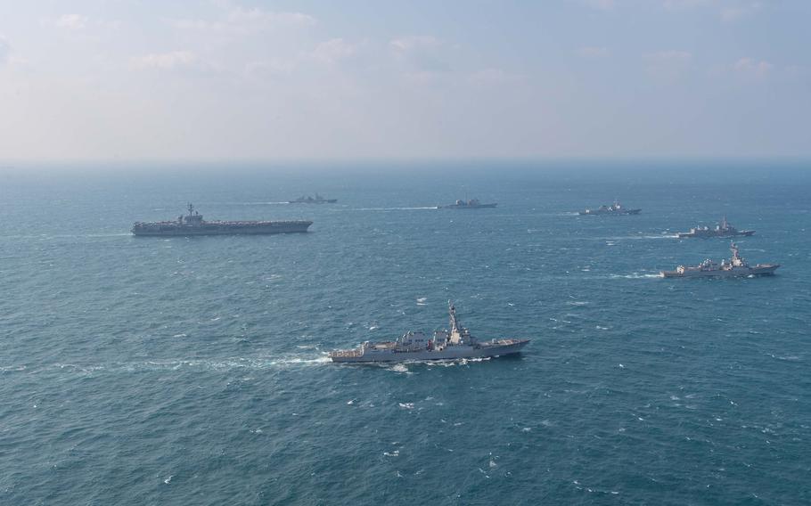 U.S. warships and ships from Japan and South Korea transit through the sea.