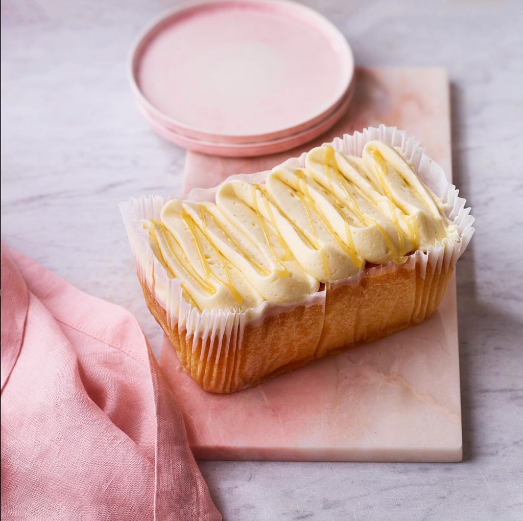 A lemon sponge cake served on a pink plate