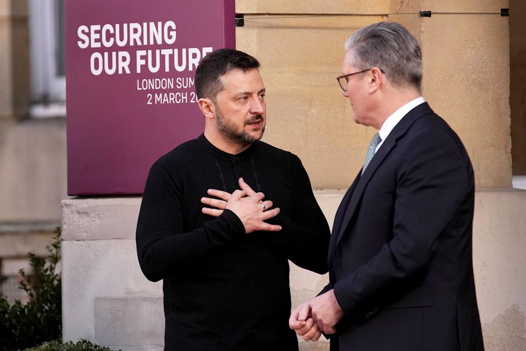 Britain's Prime Minister Keir Starmer, right, speaks with Ukraine's President Volodymyr Zelenskyy as he arrives for a summit on Ukraine at Lancaster House in London, Sunday, March 2, 2025. (AP Photo/Christophe Ena, Pool)