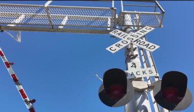 Trains stopped at railroad crossings for hours hurting business, cafe owner says