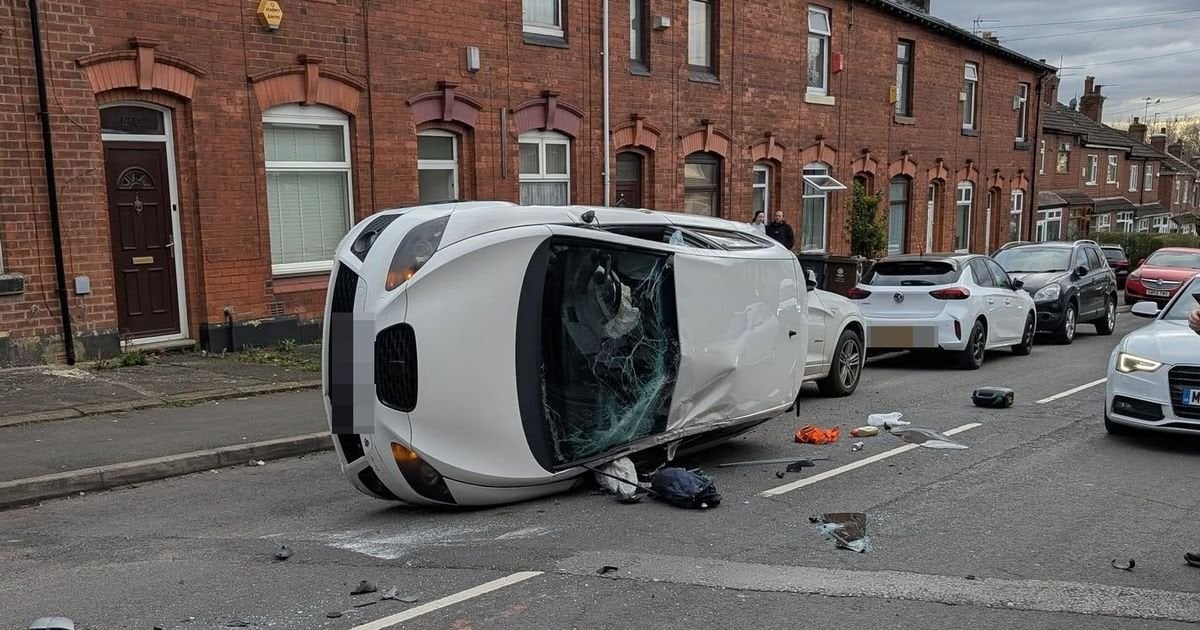 Driver hits parked cars on 'race track road' and flips vehicle in dramatic crash
