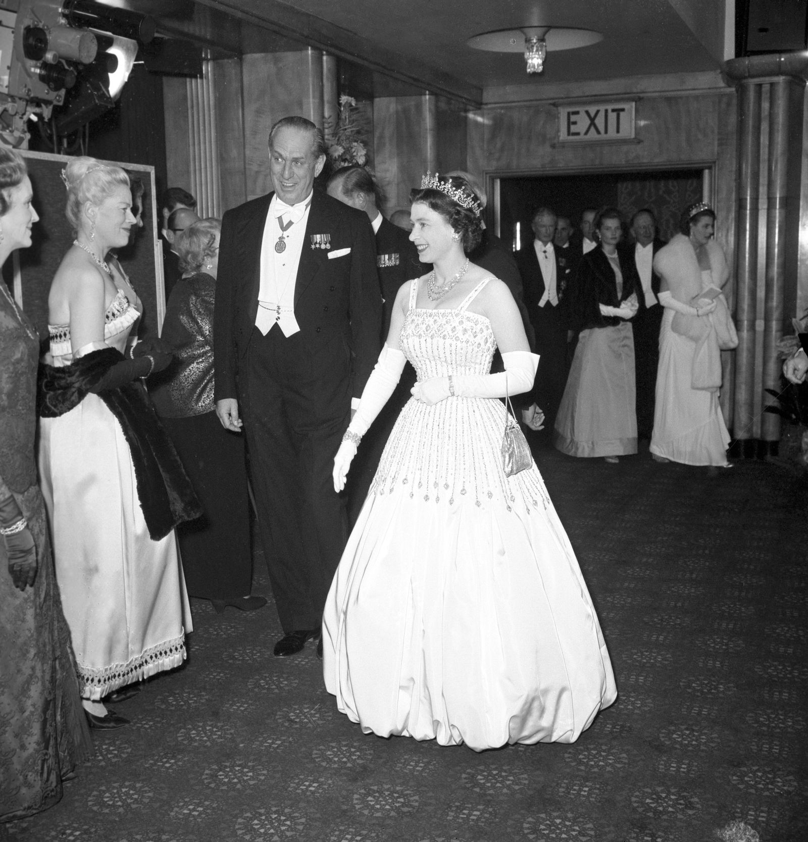 Image may contain Formal Wear Clothing Dress Suit Fashion Gown Wedding Wedding Gown Adult Person Tuxedo and Face