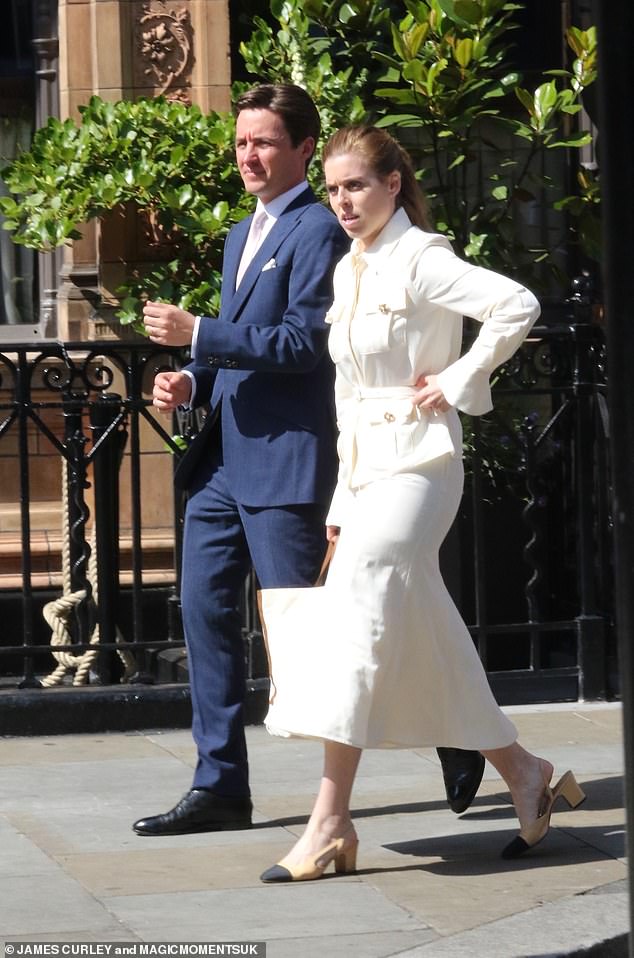 Beatrice is seen with her husband Edo