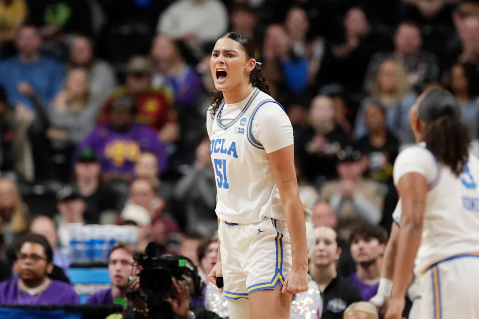 UCLA center Lauren Betts (51) reacts after scoring and drawing a foul during the first half against LSU in the Elite Eight of the NCAA college basketball tournament, Sunday, March 30, 2025, in Spokane, Wash. (AP Photo/Young Kwak)