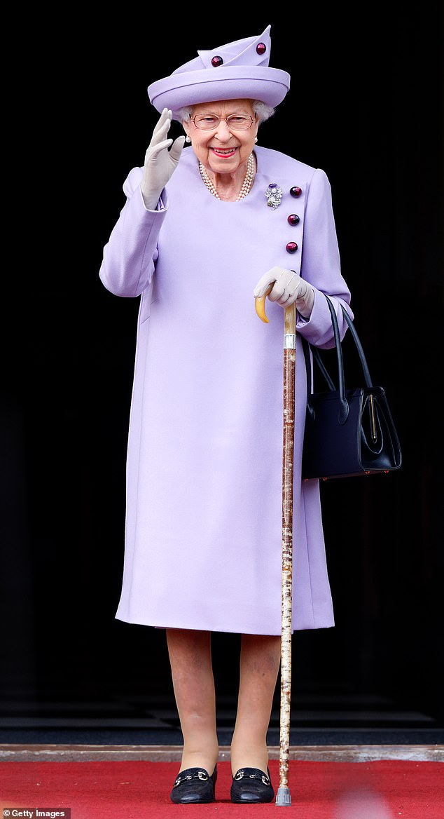 Queen Elizabeth's outfits were carefully considered to ensure she stood out in a crowd of well-wishers - despite her modest height of 5ft 3in. Above: The Queen attends a parade in the gardens of the Palace of Holyroodhouse on June 28, 2022