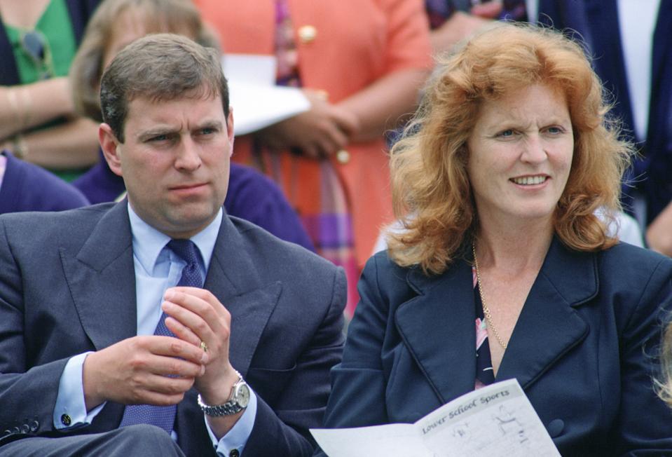 Prince Andrew wearing a blue suit sitting next to Sarah Ferguson at a 1993 sports day