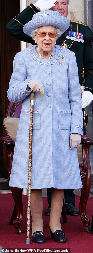 The Queen wore a cornflower blue outfit at the The Royal Company of Archers Reddendo Parade, held in the gardens of the Palace of Holyroodhouse, in June 2022