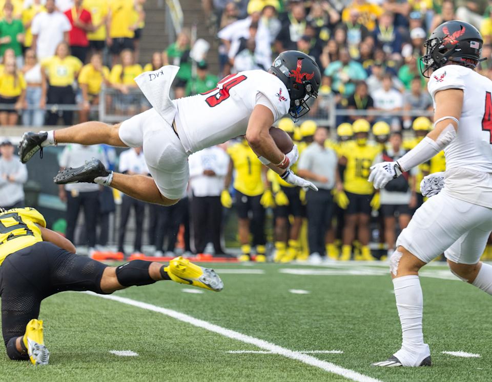 EUGENE, OR - SEPTEMBER 10: Kilohana Haasenritter #29 of the Oregon Ducks upends Efton Chism III #89 of the Eastern Washington Eagles during the first half of the game at Autzen Stadium on September 10, 2022 in Eugene, Oregon. (Photo by Tom Hauck/Getty Images)