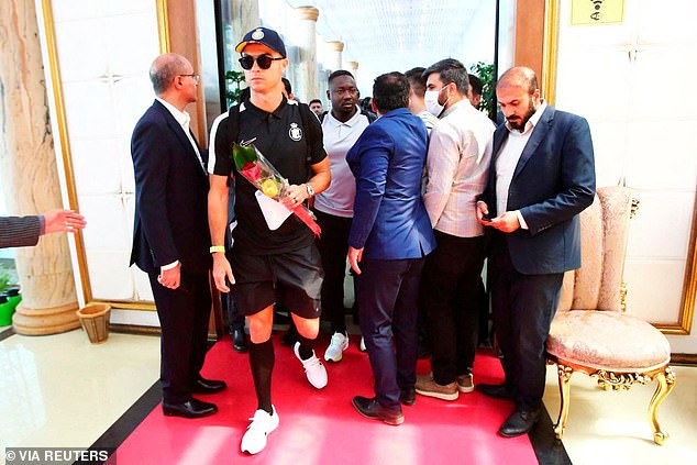 He was given flowers upon his arrival in Tehran before fans stormed Al-Nassr's team hotel