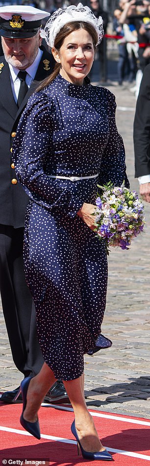 In May 2024, Queen Mary stepped aboard The Royal Ship Dannebrog in Copenhagen, wearing the Iris & Ink 'Alison' polka dot satin midi dress
