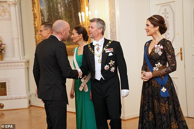 He was pictured shaking hands with Danish head coach of the Finnish national football team, Jacob Friis
