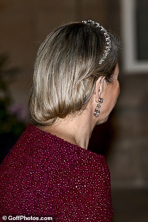 She added a dazzling headband, which matched her statement diamond earrings