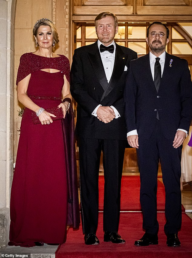 Máxima wore subtle evening make-up, including a smoky eye and berry-coloured lipstick
