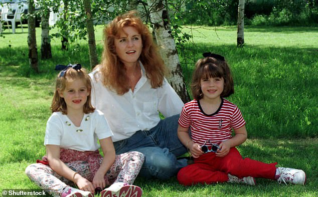 Sarah pictured with her two daughters Princess Beatrice (left) and Princess Eugenie (right) on the day of her divorce from Prince Andrew