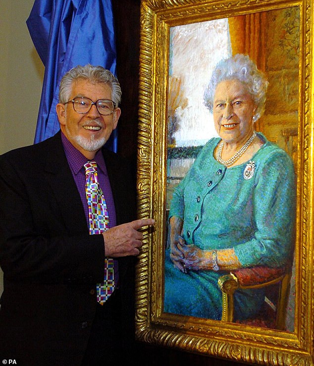 File photo dated 19/12/05 of Rolf Harris unveiling his new portrait of Britain's Queen Elizabeth II at the Queen's Gallery, Buckingham Palace