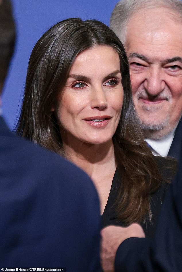Letizia wore her glossy brunette tresses out in a classic blow dry style, adding to her polished look