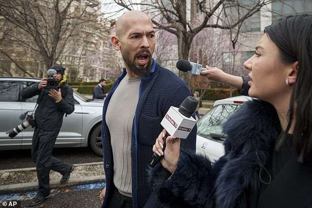 Andrew Tate speaks to a reporter after leaving the Bucharest Tribunal in March 2024