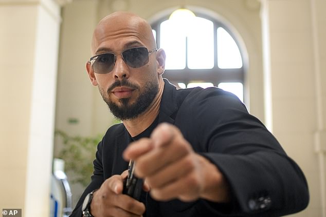 Andrew Tate strikes a pose at the Court of Appeals in Bucharest, Romania, in July 2024