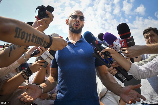 Andrew Tate speaks to media after being released from house arrest and put under judicial control measures, on the outskirts of Bucharest in August 2023