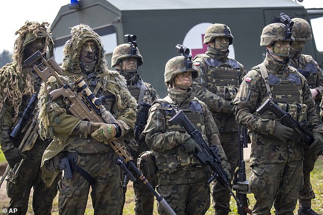 Polish Army soldiers take part in a Lithuanian-Polish Brave Griffin 24/II military exercise near the Suwalki Gap near the Polish border at the Dirmiskes village, in Lithuania on Friday, April 26, 2024