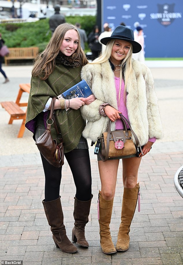 A pair of friends pose for pictures on day two of the Cheltenham festival