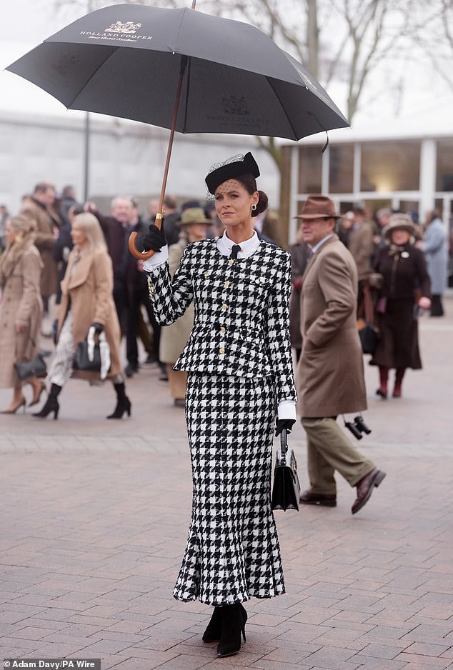 British designer Jade Holland Cooper looked chic in a black-and-white houndstooth co-ord set, comprising a blazer and long, fitted skirt, worn over a crisp white shirt and black tie