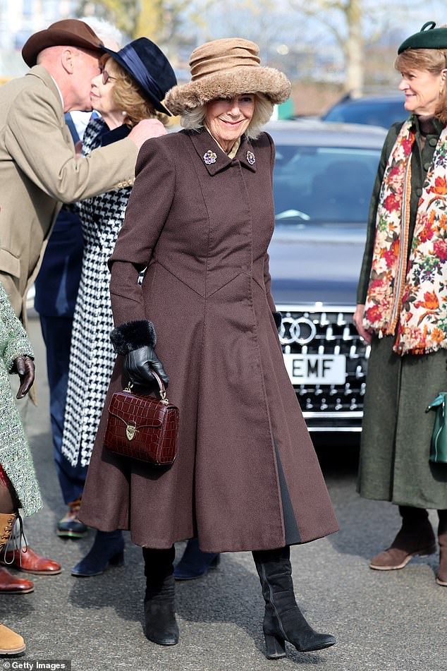 She added black suede boots - believed to be from Russell and Bromley