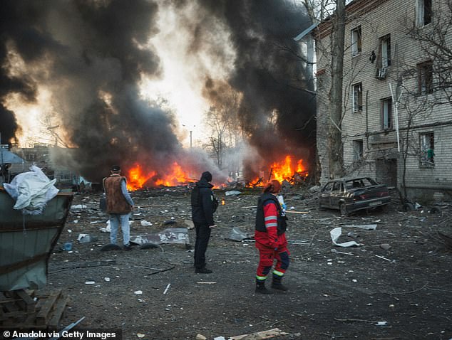 Emergency teams and civilians are at the scene where a Russian Iskander missile hit a civilian infrastructure facility, causing an explosion and fire in Kharkiv, Ukraine on March 7, 2025