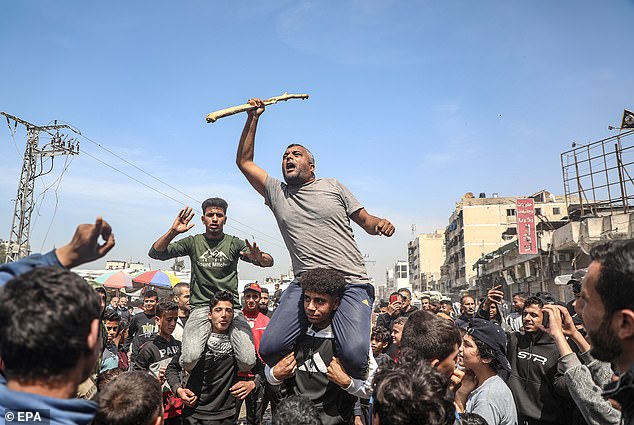 Palestinians gather to protest against the ongoing Israel-Hamas war and the Israeli blockade of the Gaza Strip, in Gaza City, on 26 March