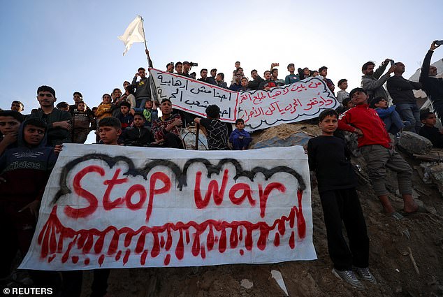 Palestinians protest to demand an end to war, on March 26 in Gaza