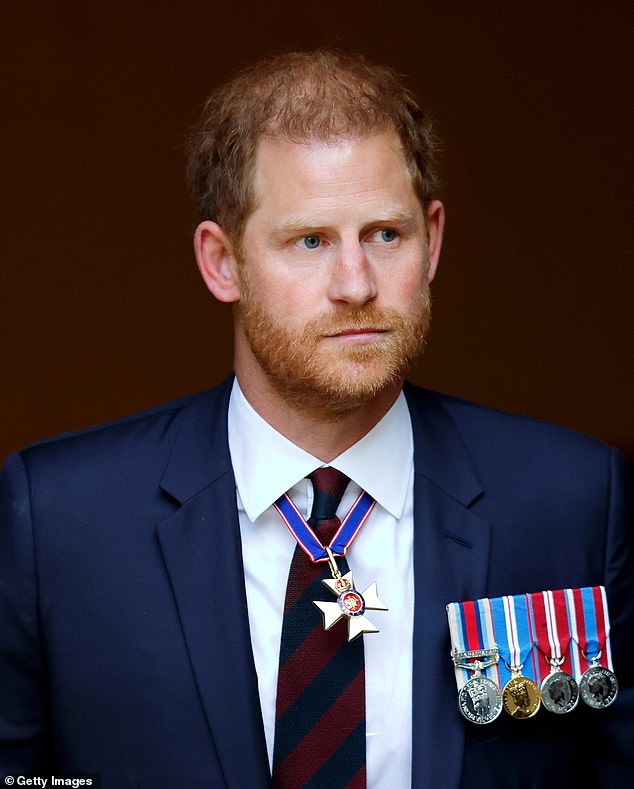 Prince Harry (pictured) only heard his father was in hospital after suffering side effects from his cancer treatment when the news broke to the rest of the world, it has been claimed