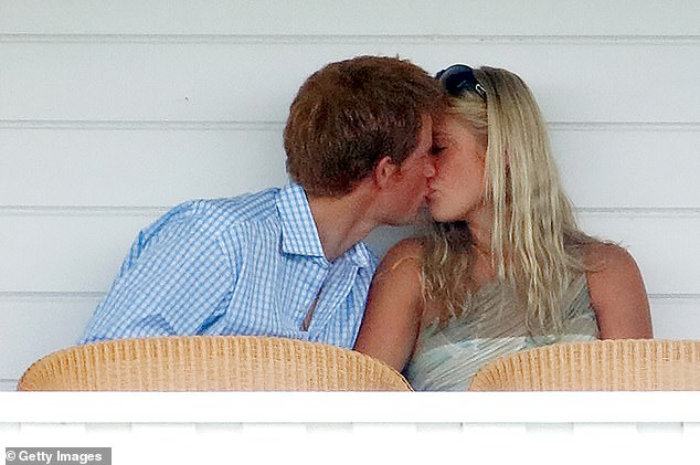 Prince Harry and Chelsy Davy kiss whilst sitting in the Royal Box as they attend the Cartier International Polo Match at Guards Polo Club in 2006