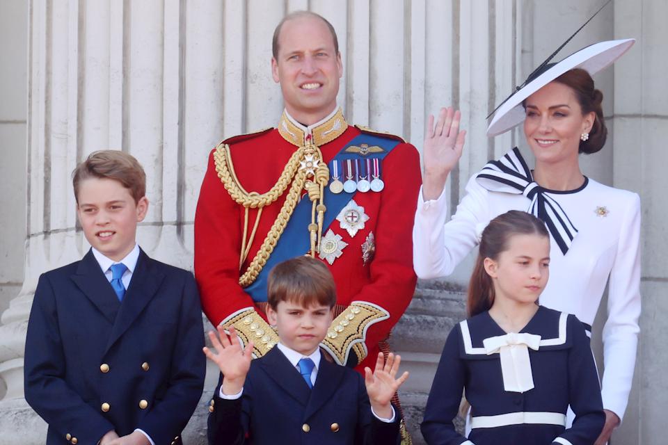 Prince William, Princess Kate, Prince George, Prince Louis, Princess Charlotte waving on the balcony of Buckingham Palace