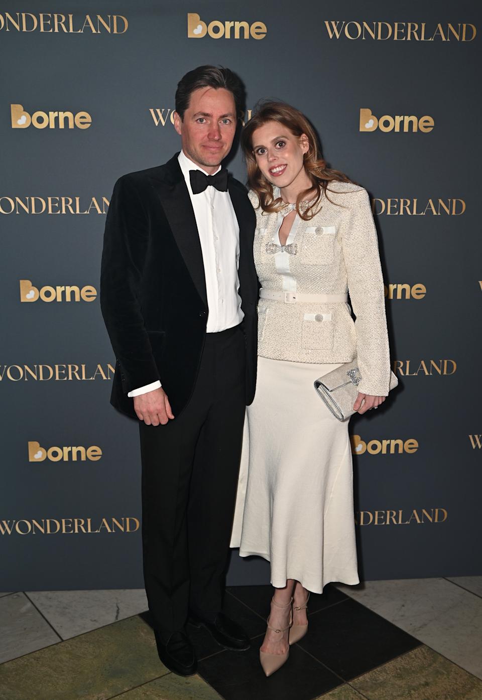 Edo Mapelli Mozzi wearing a tux standing with Princess Beatrice, wearing a white dress, on the red carpet in March 2025