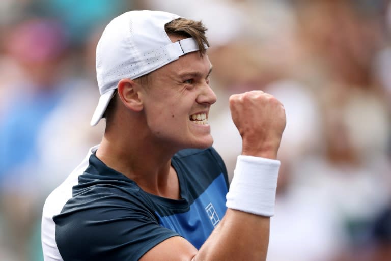 Denmark's Holger Rune celebrates his upset win over Stefanos Tsitsipas in the fourth round at Indian Wells (CLIVE BRUNSKILL)