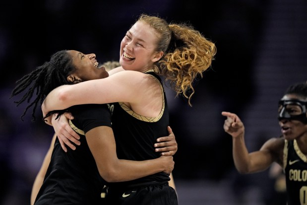 Colorado guard Tameiya Sadler, left, and teammate Frida Formann celebrate after their second-round college basketball game against Kansas State in the women's NCAA Tournament in Manhattan, Kan., Sunday, March 24, 2024, in Manhattan, Kan. Colorado won 60-53. (AP Photo/Charlie Riedel)