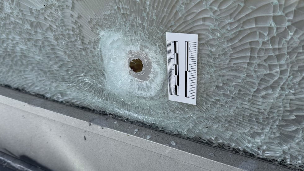 Bullet hole in exit door of Club Elevate